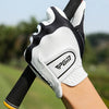 A close-up of a white and black men's golf glove being worn on a wrist.