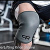 A close-up of a gray knee sleeve worn on an arm during a workout, featuring a personalized logo.