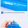 A hand holds a blue foldable sports water bottle, demonstrating its portability and design.