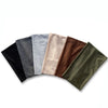 A collection of ten extra wide boho headbands in various muted earth tones and grays.