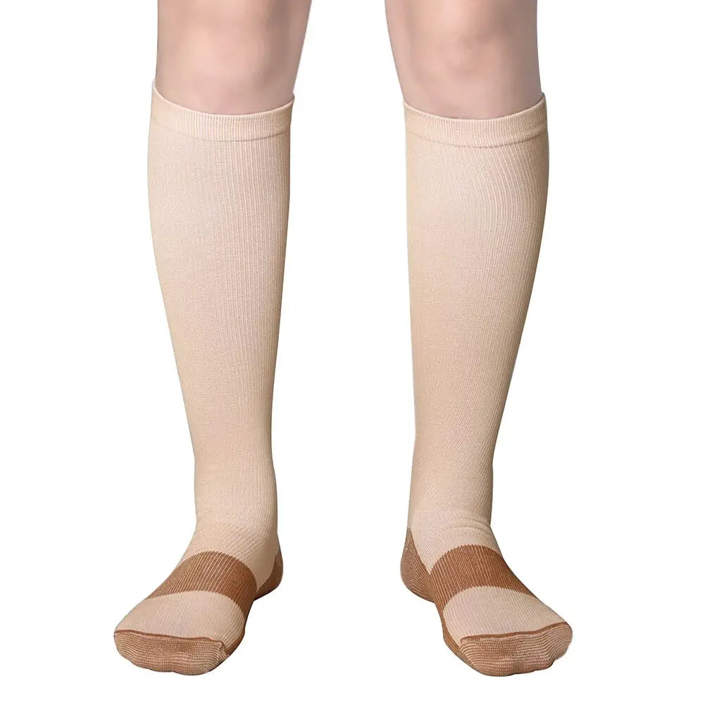 Pair of beige medical grade compression socks for veins and circulation