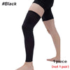 Black full leg compression sleeve worn on a person's leg.