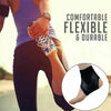 Close-up of a person wearing a black ankle support compression sleeve on their foot.