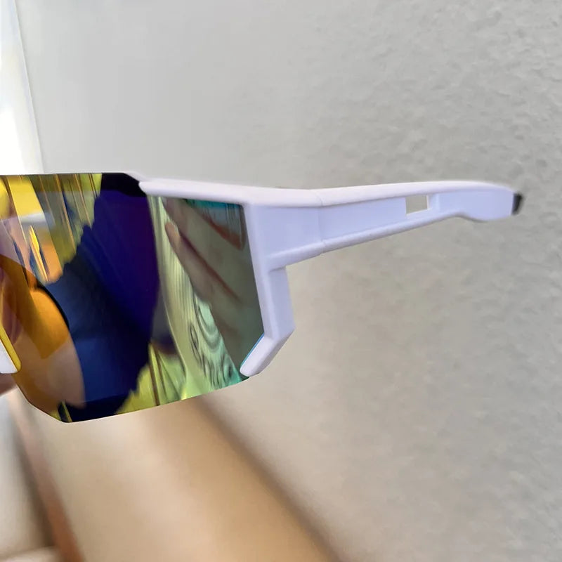 White cycling sunglasses with mirrored lenses are shown against a light background.