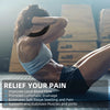 A woman stretches her leg while applying kinesiology tape to her muscle and joint for pain relief.