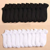 A set of black and white breathable unisex boat socks laid out in rows.