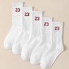 A stack of white men's classic crew socks with red numbering indicating size 23.