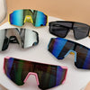 A collection of colorful sports sunglasses for kids, including blue, yellow, and black frames.