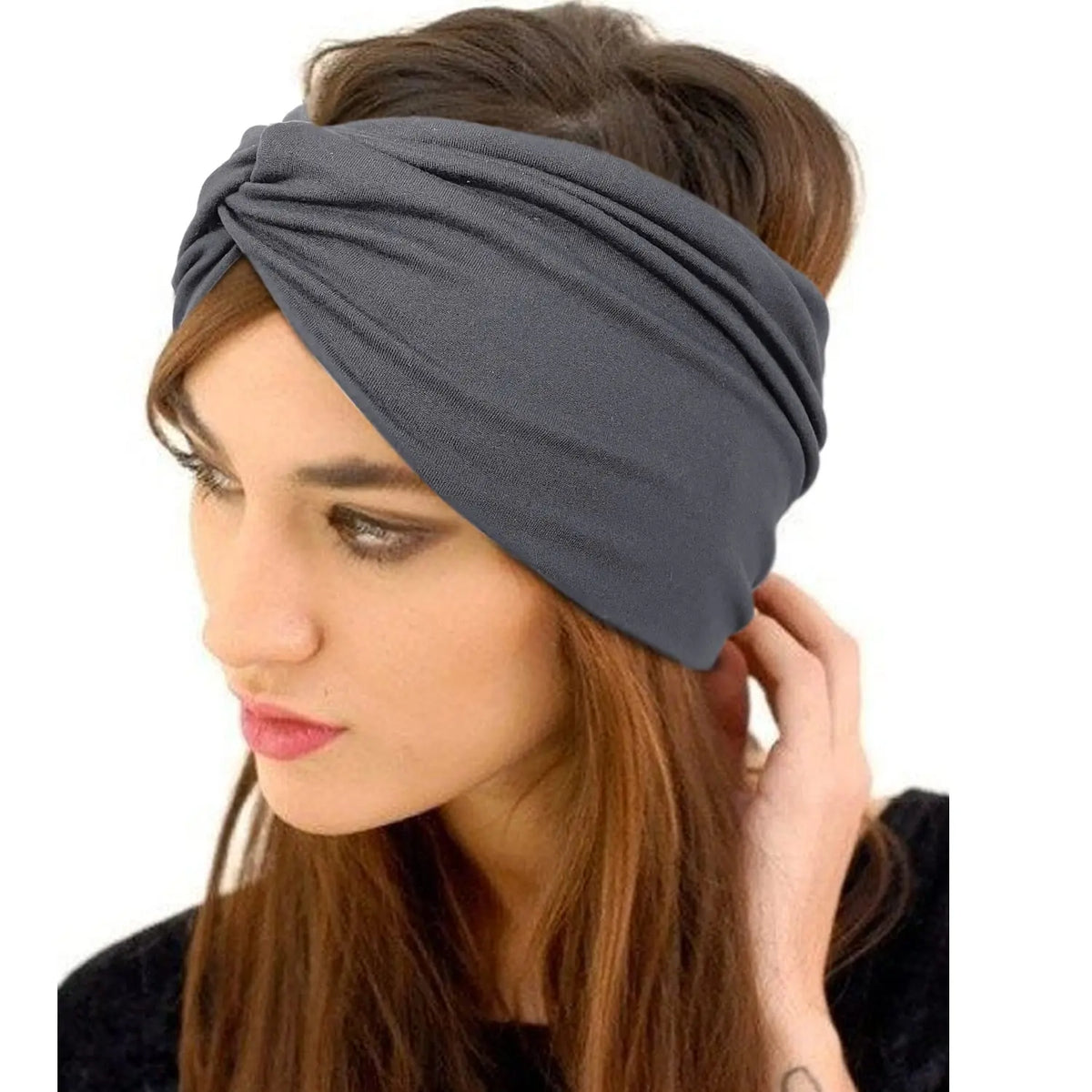 A woman wearing a gray boho wide turban headband on her hair.