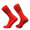 Pair of red honeycomb grip football socks shown from the side.
