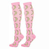Pair of pink compression elastic socks with yellow curved patterns