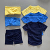 Un ensemble de vêtements de sport et de yoga sans couture, comprenant un haut jaune, un haut bleu et un short marine.