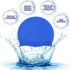 A bright blue silicone swim cap is shown splashing water, highlighting its durability and flexibility.