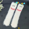 Pair of white plush caterpillar floor socks with blue accents