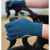 A hand wearing a blue cycling glove with silicone palm pads gripping a bicycle handlebar.