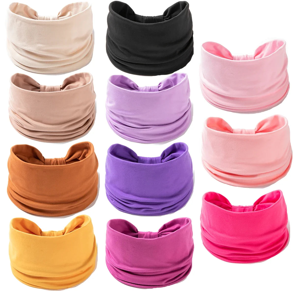 A collection of various colored boho wide headband hair wraps for women.