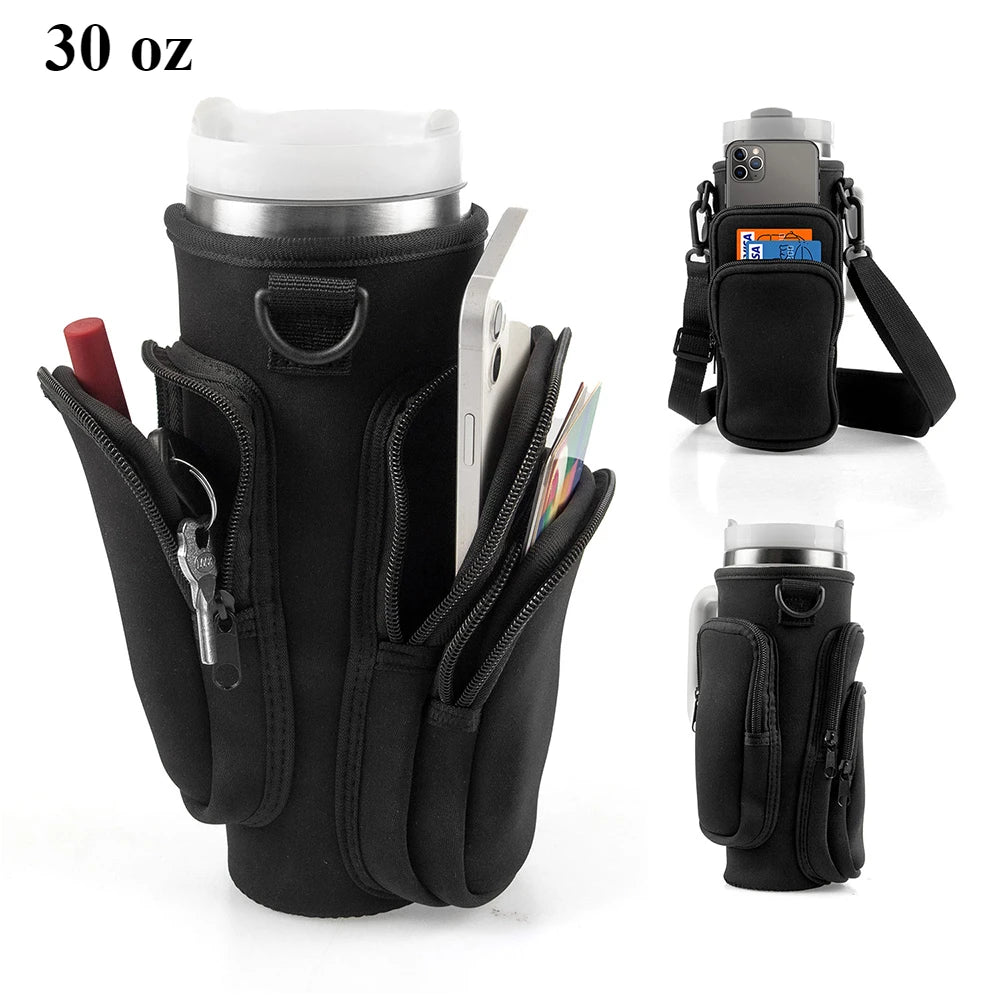 Black versatile water bottle carrier bag holding a tumbler and a smartphone.