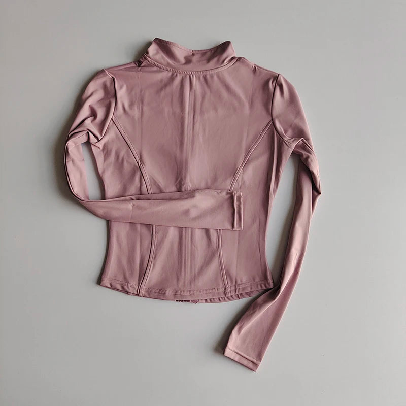A mauve long-sleeved quick-dry yoga and fitness jacket displayed flat.