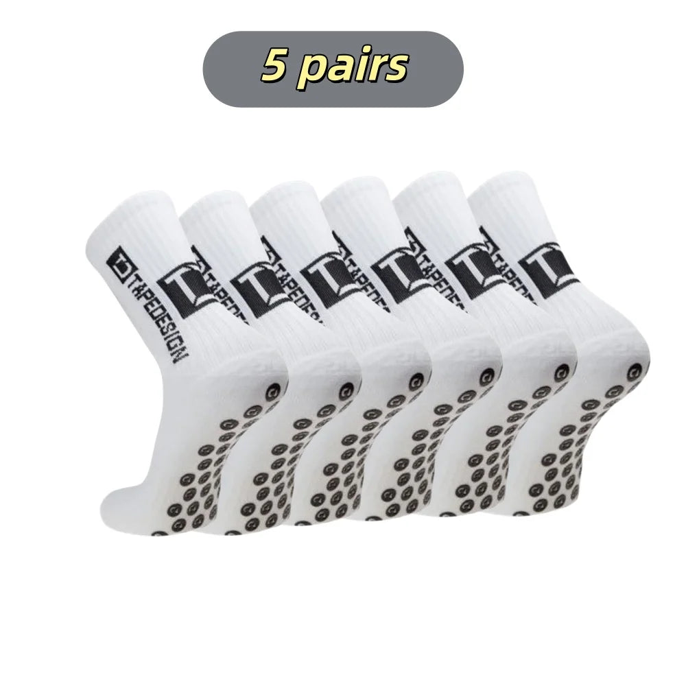 Five pairs of white mid-calf football socks are displayed in a row.