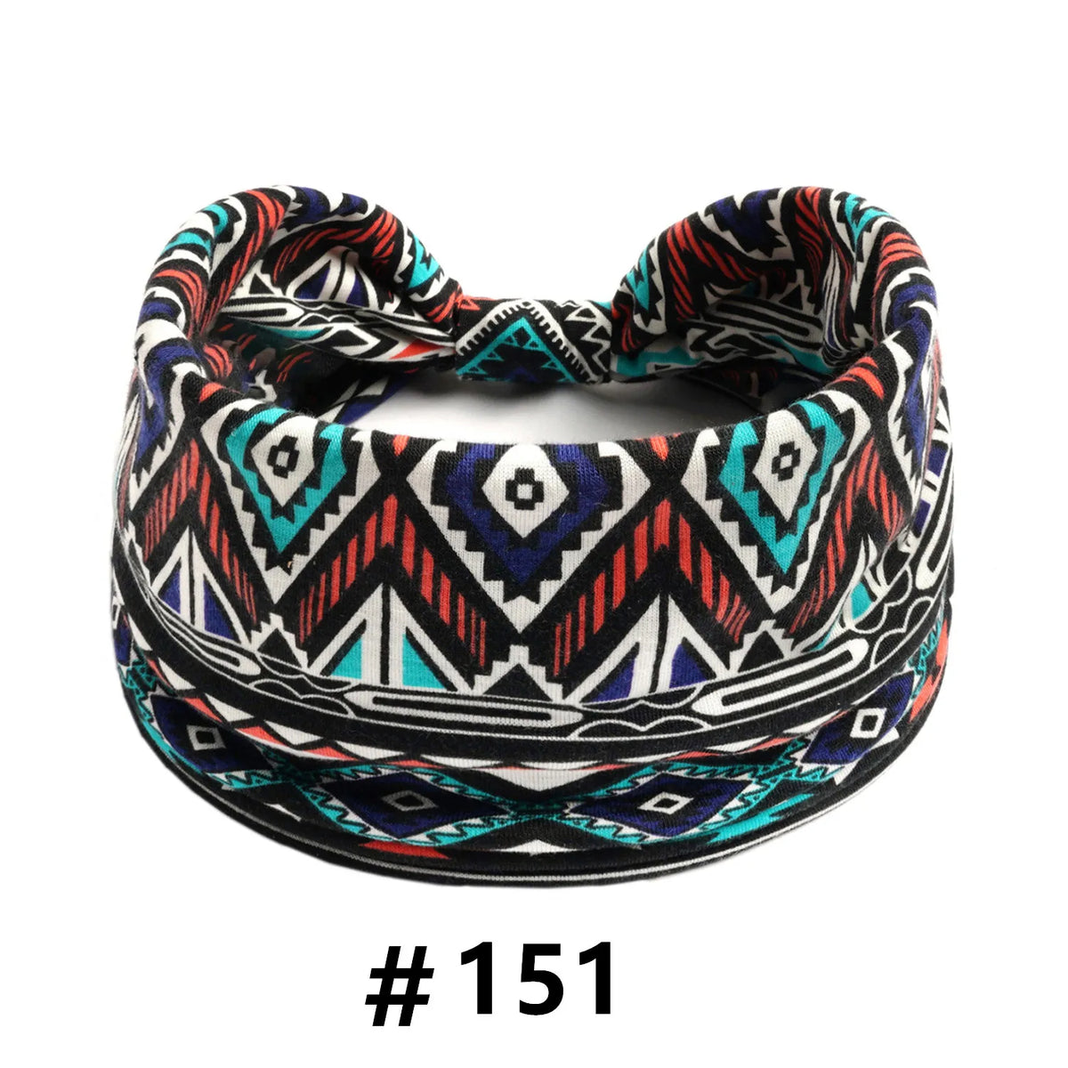 A patterned boho cotton turban headband featuring geometric designs in black, white, red, and teal.