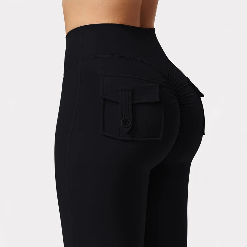 Black high stretch women's yoga leggings featuring a front pocket detail.