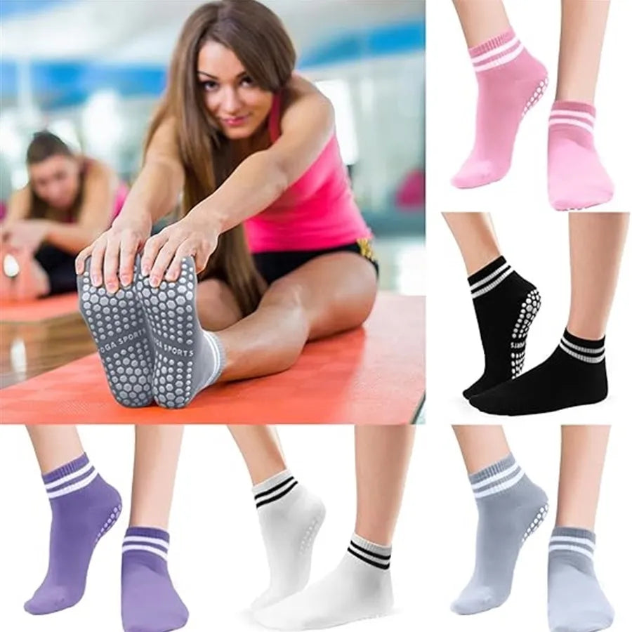 A collection of non-slip grip socks in various colors and patterns for yoga and pilates.