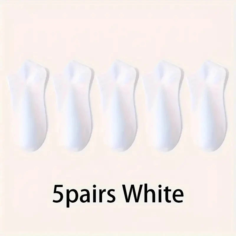Five pairs of white comfort fit ankle socks laid out side by side.