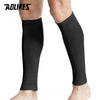 Black compression leg sleeves worn on a person's lower leg.