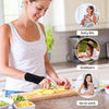 A woman prepares food on a cutting board while wearing a dual wrist support brace for tendonitis and carpal tunnel.