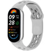 A white smart watch band replacement with a black face displaying workout data and a rainbow graphic.