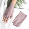 A pair of mauve women's thin stretch elastane gloves displayed on a white surface.