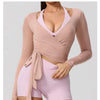 A model wearing a mauve long sleeve top and matching shorts for a product showcase.