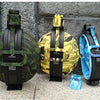 Three collapsible silicone camping kettles in camouflage, yellow, and blue colors displayed on a gray background.