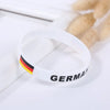 White silicone wristband with the German flag colors and the word GERMANY printed on it.