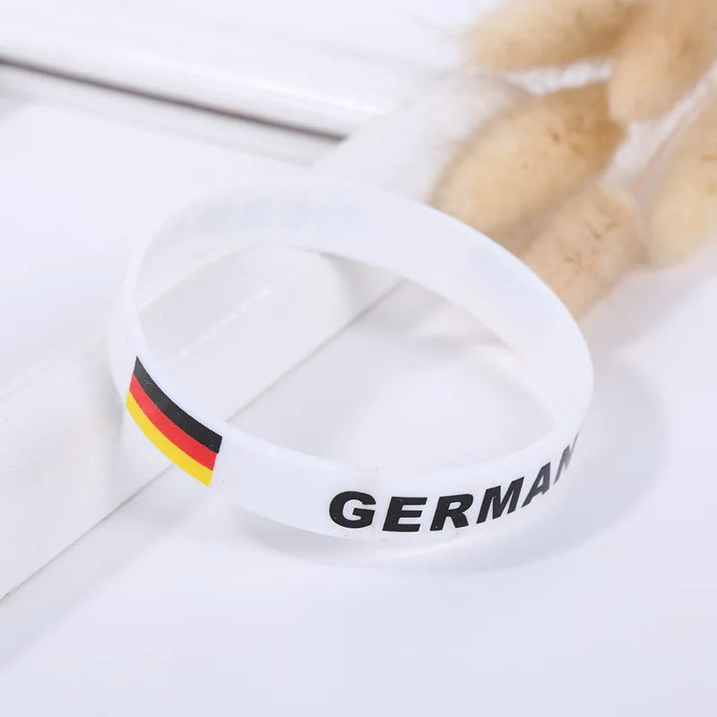 White silicone wristband with the German flag colors and the word GERMANY printed on it.