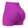 A pair of bright magenta high-waisted knit fitness shorts shown from the rear view.