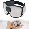A sleep headphone is shown resting on a person's forehead while they are lying down.