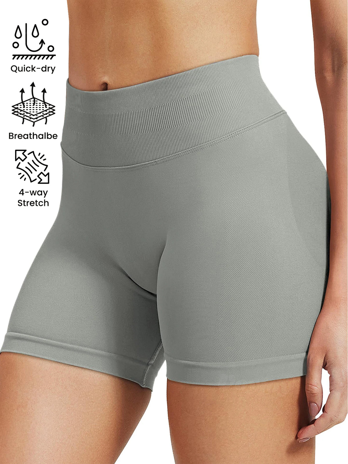 A model is wearing high-waisted gray knit fitness shorts, highlighting features like quick-dry and 4-way stretch.