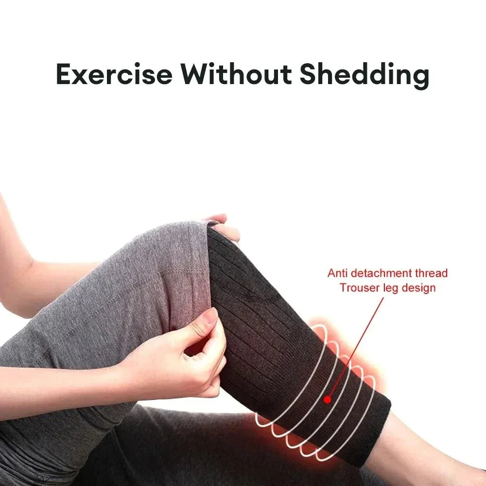 A person is wearing thick, dark gray knee warmers or leg guards designed to prevent shedding.