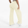 A person wearing light beige NCLAGEN SoftMotion straight leg yoga pants.