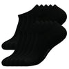 A set of black men's essential warm socks stacked together.