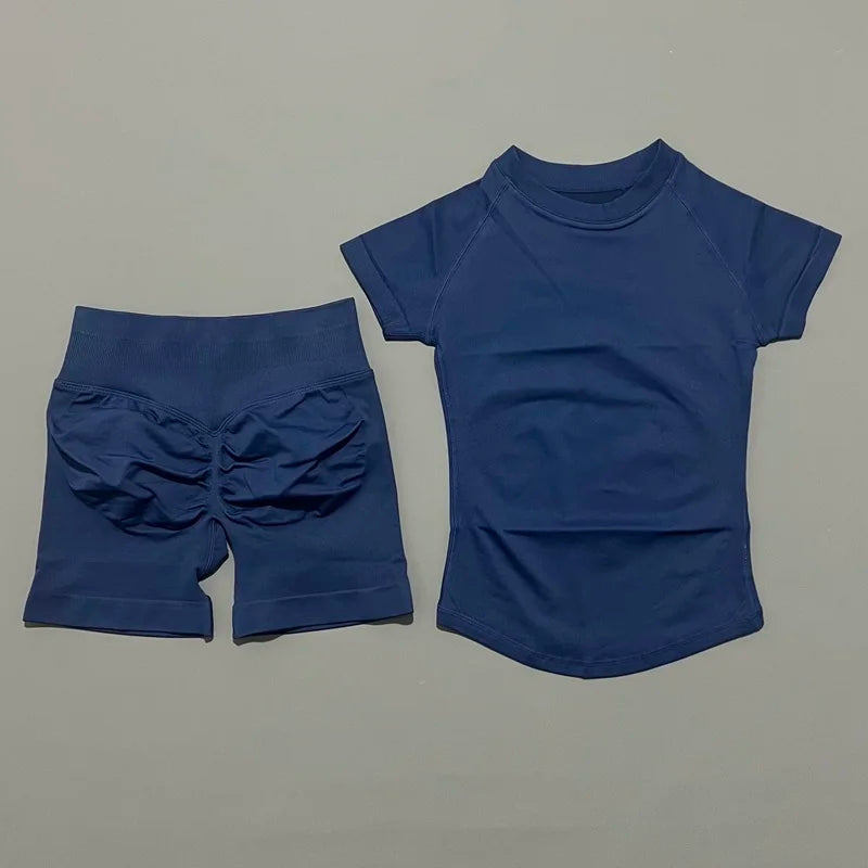 A royal blue seamless yoga set for women featuring a short sleeve top and workout leggings.