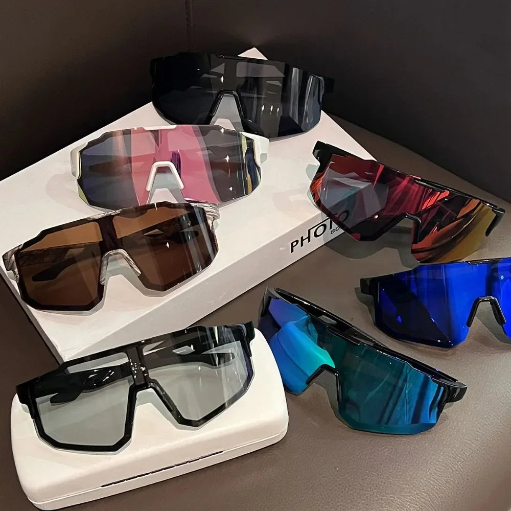 A collection of various colored sport cycling and skiing goggles displayed on a white box.