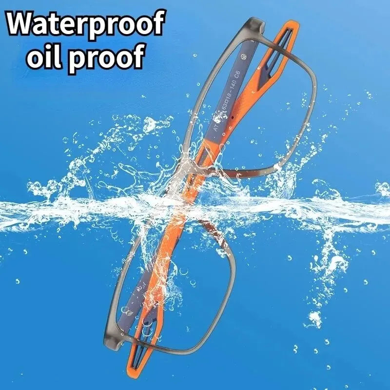 An orange and black sports reading glasses frame is shown being splashed by water, demonstrating its waterproof oil proof qua