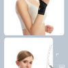 A female model demonstrates the use of a black wrist support brace for fitness.