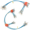 Multi-piece saltwater fishing tackle rig with blue and orange fishing lines and hooks