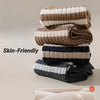 A stack of soft, skin-friendly casual striped men's socks in beige, brown, and gray tones.