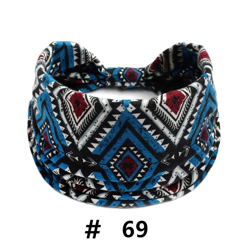 A black, white, and blue patterned boho cotton turban headband for workout or yoga.