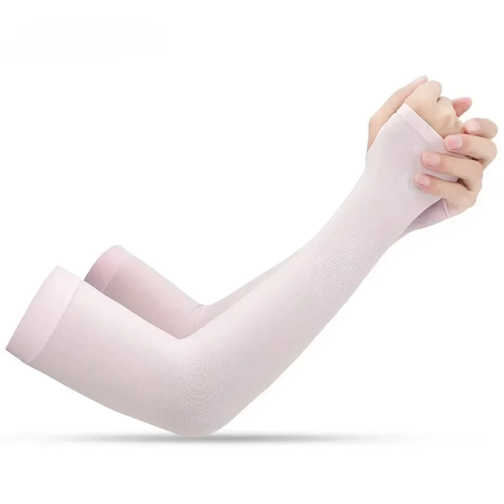 A person is wearing a light pink UV protection arm sleeve on their forearm.