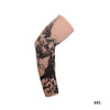 A beige reusable stretch tattoo arm sleeve featuring a black silhouette design.